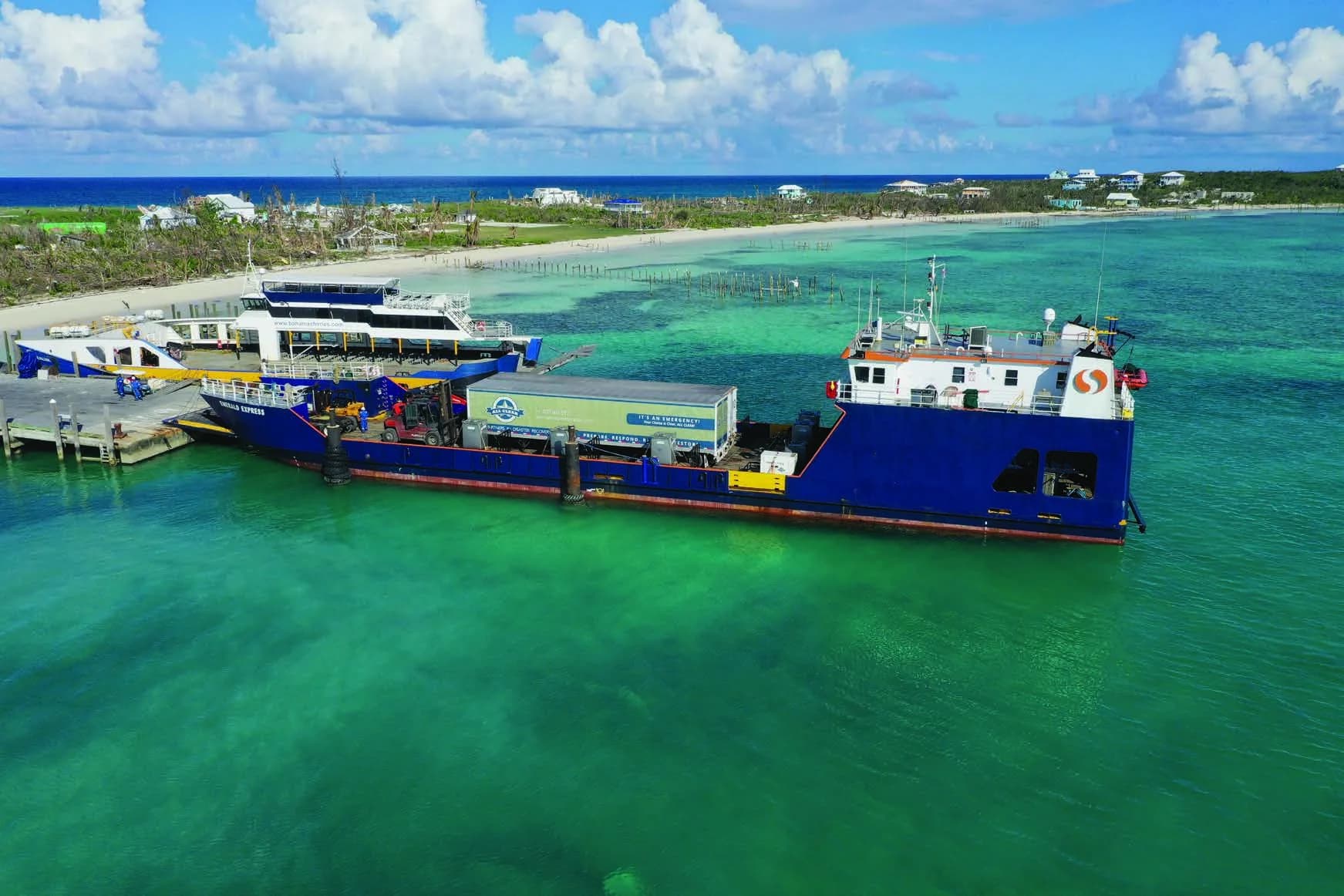 An ALL CLEAR trailer on a supply barge docked off a hurricane-hit island in the Bahamas